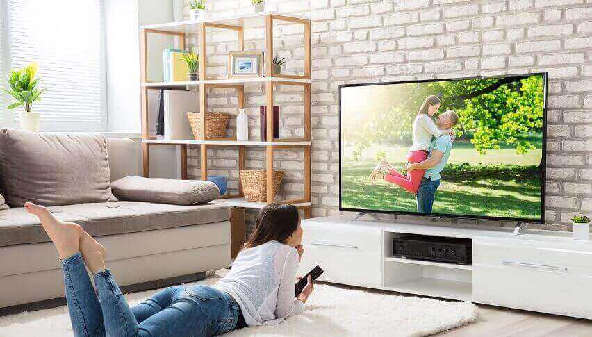 Girl Watching TV Lying on Floor